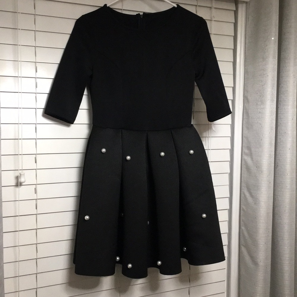 Black dress with pearl details